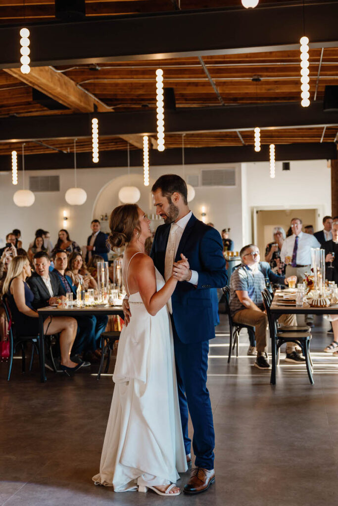 A newlywed couple during their first dance 