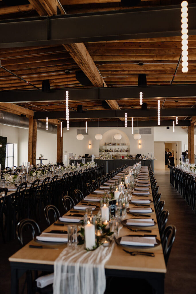 Long wedding reception tables set up in a reception hall 