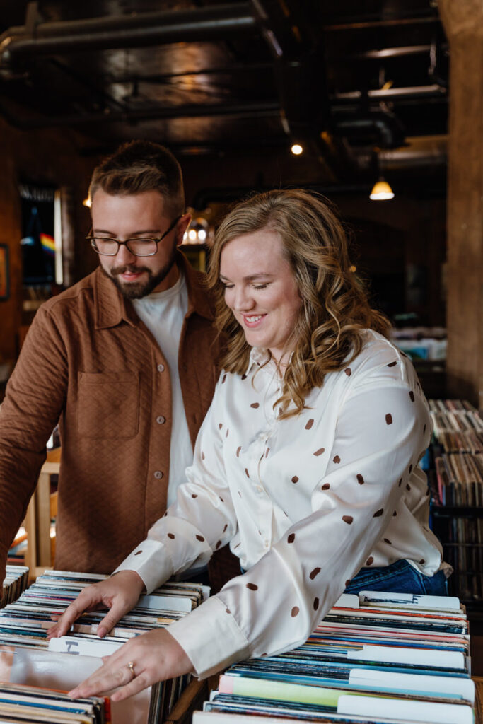 A couple looking through vinyls in a record shop