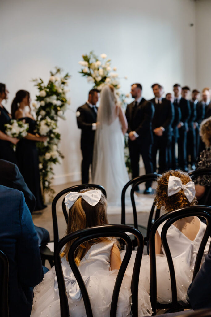 Guests looking on during a wedding ceremony 